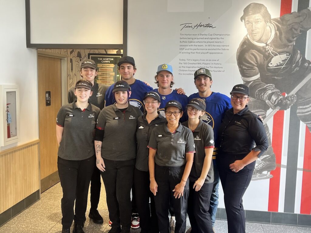 Kelton Enterprises Tim Hortons team with Buffalo Sabres players during Community Day event in Tonawanda, NY.