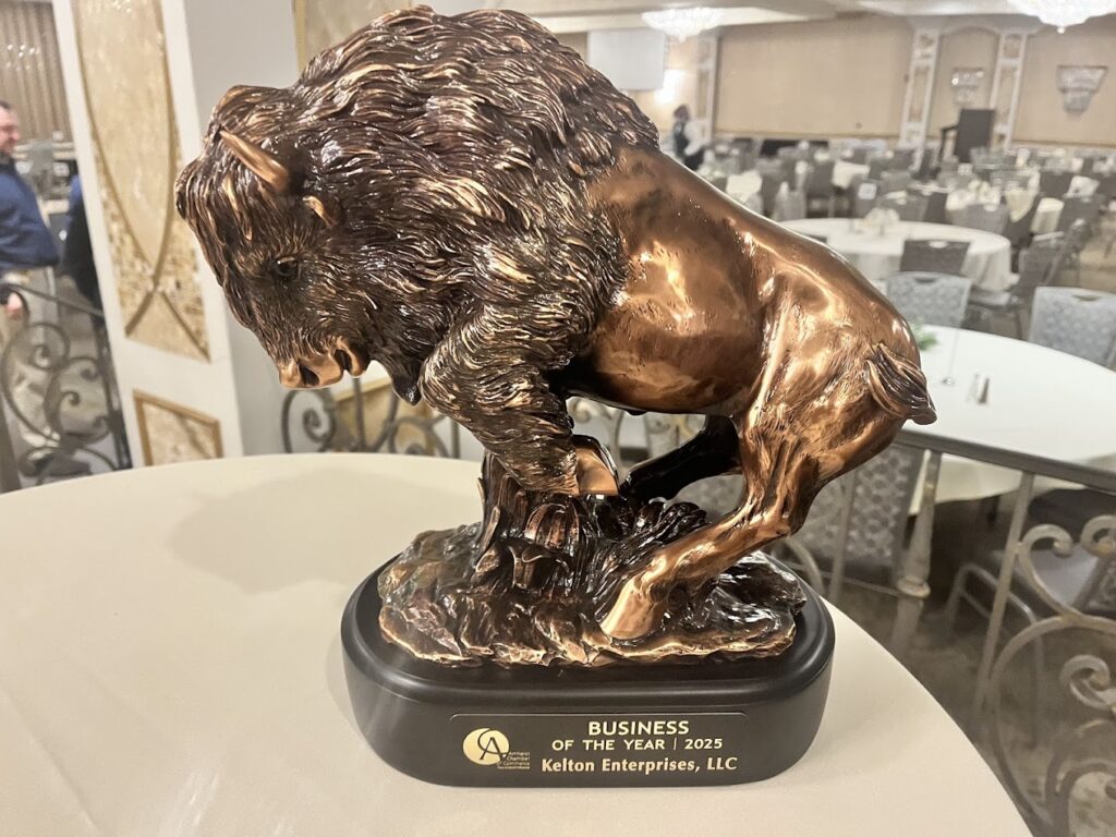 Kelton Enterprises celebrates the Amherst Chamber of Commerce Business of the Year Award.