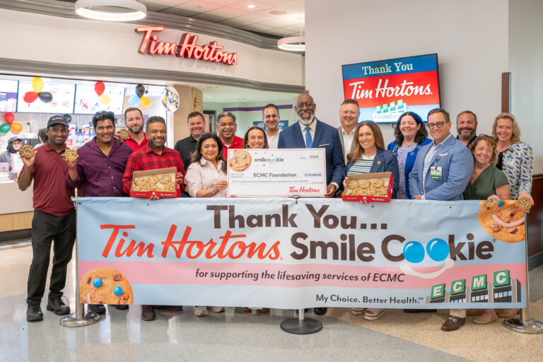 David and Allanna Beaton participate in the 2026 Tim Hortons Smile Cookie check presentation at ECMC